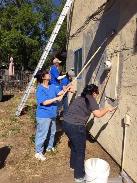 Rebuilding Sacramento volunteers painting